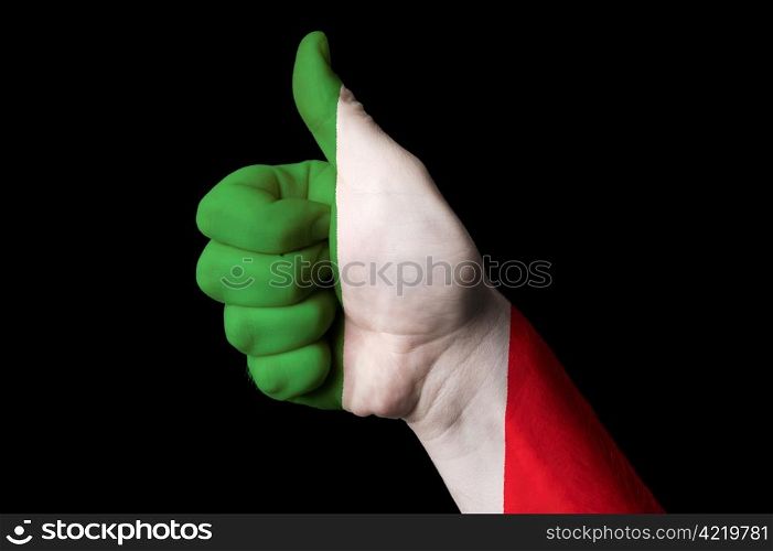 Hand with thumb up gesture in colored italy national flag as symbol of excellence, achievement, good, - useful for tourism and touristic advertising and also current positive political, cultural, social management of state or country