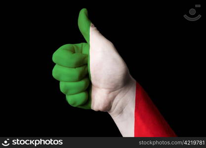 Hand with thumb up gesture in colored italy national flag as symbol of excellence, achievement, good, - useful for tourism and touristic advertising and also current positive political, cultural, social management of state or country