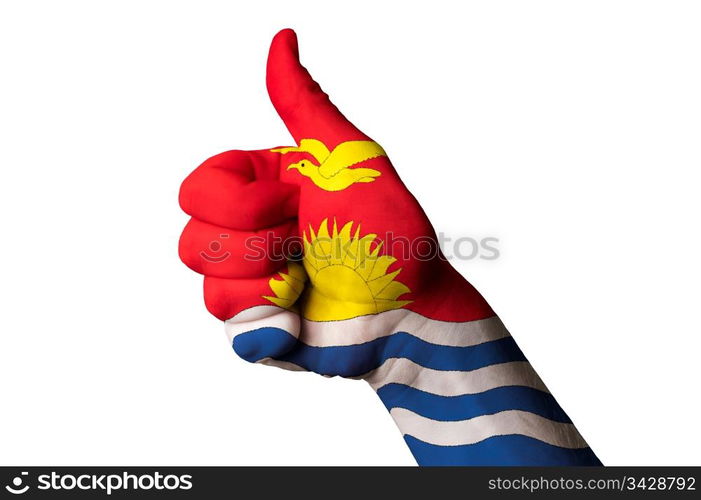 Hand with thumb up gesture in colored kiribati national flag as symbol of excellence, achievement, good, - for tourism and touristic advertising, positive political, cultural, social management of country