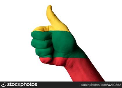 Hand with thumb up gesture in colored lithuania national flag as symbol of excellence, achievement, good, - useful for tourism and touristic advertising and also current positive political, cultural, social management of state or country