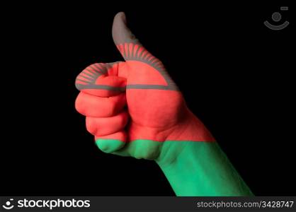 Hand with thumb up gesture in colored malawi national flag as symbol of excellence, achievement, good, - for tourism and touristic advertising, positive political, cultural, social management of country