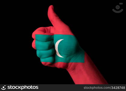 Hand with thumb up gesture in colored maldives national flag as symbol of excellence, achievement, good, - for tourism and touristic advertising, positive political, cultural, social management of country