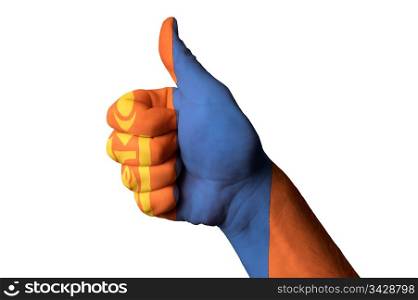 Hand with thumb up gesture in colored mongolia national flag as symbol of excellence, achievement, good, - for tourism and touristic advertising, positive political, cultural, social management of country
