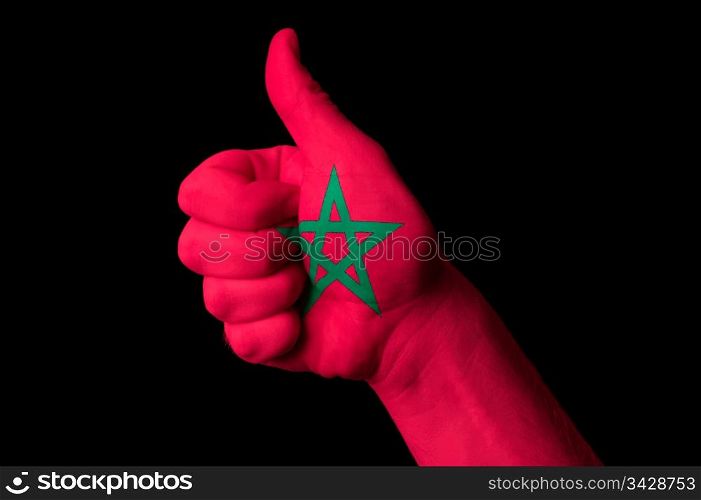 Hand with thumb up gesture in colored morocco national flag as symbol of excellence, achievement, good, - for tourism and touristic advertising, positive political, cultural, social management of country