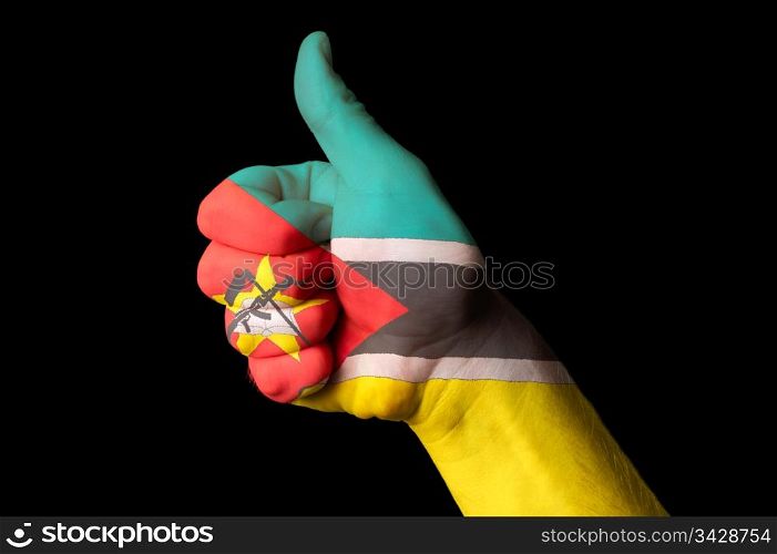 Hand with thumb up gesture in colored mozambique national flag as symbol of excellence, achievement, good, - for tourism and touristic advertising, positive political, cultural, social management of country