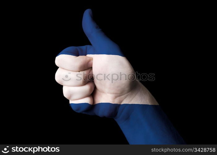 Hand with thumb up gesture in colored nicaragua national flag as symbol of excellence, achievement, good, - for tourism and touristic advertising, positive political, cultural, social management of country