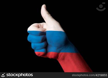 Hand with thumb up gesture in colored russia national flag as symbol of excellence, achievement, good, - useful for tourism and touristic advertising and also current positive political, cultural, social management of state or country