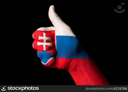 Hand with thumb up gesture in colored slovakia national flag as symbol of excellence, achievement, good, - useful for tourism and touristic advertising and also current positive political, cultural, social management of state or country