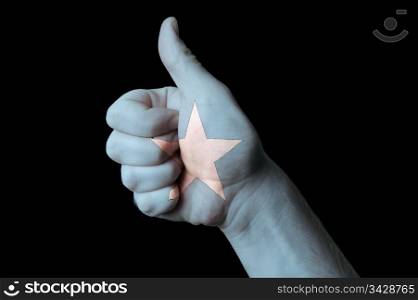 Hand with thumb up gesture in colored somalia national flag as symbol of excellence, achievement, good, - for tourism and touristic advertising, positive political, cultural, social management of country