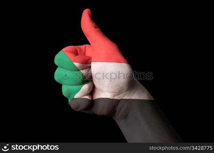 Hand with thumb up gesture in colored sudan national flag as symbol of excellence, achievement, good, - for tourism and touristic advertising, positive political, cultural, social management of country