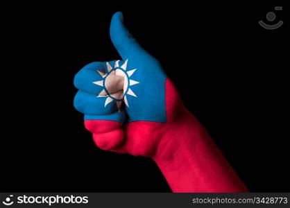 Hand with thumb up gesture in colored taiwan national flag as symbol of excellence, achievement, good, - for tourism and touristic advertising, positive political, cultural, social management of country