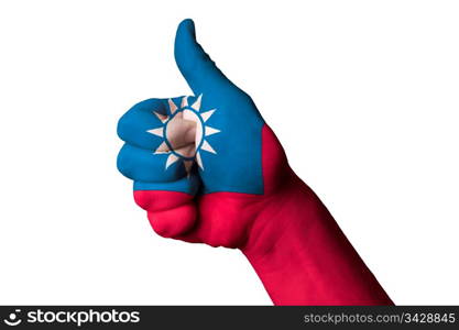 Hand with thumb up gesture in colored taiwan national flag as symbol of excellence, achievement, good, - for tourism and touristic advertising, positive political, cultural, social management of country