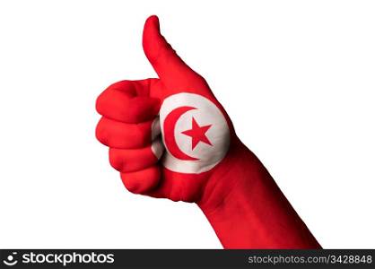 Hand with thumb up gesture in colored tunisia national flag as symbol of excellence, achievement, good, - for tourism and touristic advertising, positive political, cultural, social management of country
