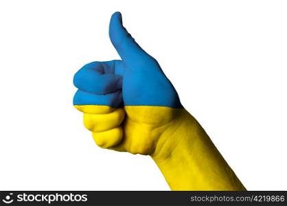 Hand with thumb up gesture in colored ukraine national flag as symbol of excellence, achievement, good, - useful for tourism and touristic advertising and also current positive political, cultural, social management of state or country