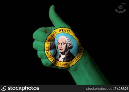 Hand with thumb up gesture in colored washington usa state flag as symbol of excellence, achievement, good, - for tourism and touristic advertising, positive political, cultural, social management of country
