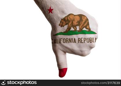 Hand with thumbs down gesture in colored american state of california flag as symbol of negative political, cultural, social management of state