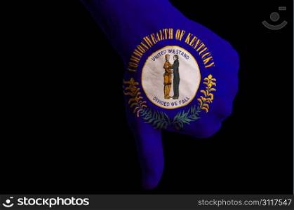 Hand with thumbs down gesture in colored american state of kentucky flag as symbol of negative political, cultural, social management of country