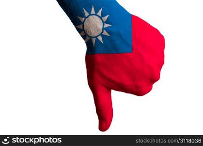Hand with thumbs down gesture in colored taiwan national flag as symbol of negative political, cultural, social management of country
