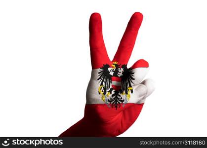 Hand with two finger up gesture in colored austria national flag as symbol of winning, victorious, excellent, - for tourism and touristic advertising, positive political, cultural, social management of country