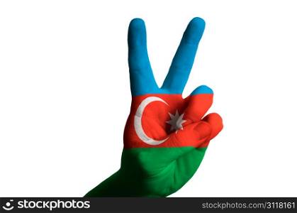 Hand with two finger up gesture in colored azerbaijan national flag as symbol of winning, victorious, excellent, - for tourism and touristic advertising, positive political, cultural, social management of country