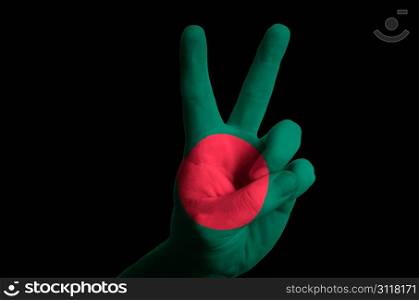 Hand with two finger up gesture in colored bangladeshi national flag as symbol of winning, victorious, excellent, - for tourism and touristic advertising, positive political, cultural, social management of country