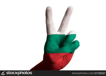 Hand with two finger up gesture in colored bulgaria national flag as symbol of winning, victorious, excellent, - for tourism and touristic advertising, positive political, cultural, social management of country