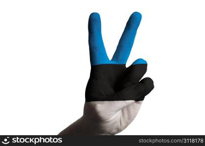 Hand with two finger up gesture in colored estonia national flag as symbol of winning, victorious, excellent, - for tourism and touristic advertising, positive political, cultural, social management of country