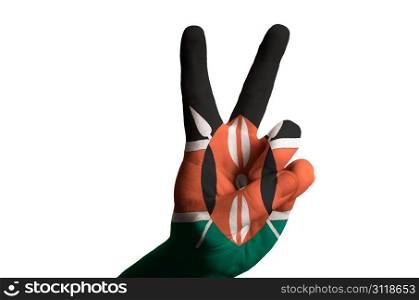 Hand with two finger up gesture in colored kenya national flag as symbol of winning, victorious, excellent, - for tourism and touristic advertising, positive political, cultural, social management of country