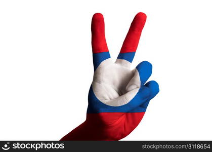 Hand with two finger up gesture in colored laos national flag as symbol of winning, victorious, excellent, - for tourism and touristic advertising, positive political, cultural, social management of country