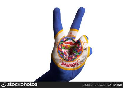 Hand with two finger up gesture in colored minnesota state flag as symbol of winning, victorious, excellent, - for tourism and touristic advertising, positive political, cultural, social management of country