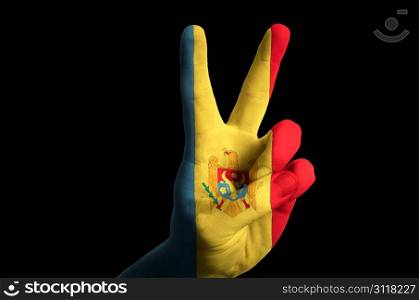 Hand with two finger up gesture in colored moldova national flag as symbol of winning, victorious, excellent, - for tourism and touristic advertising, positive political, cultural, social management of country