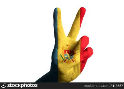 Hand with two finger up gesture in colored moldova national flag as symbol of winning, victorious, excellent, - for tourism and touristic advertising, positive political, cultural, social management of country
