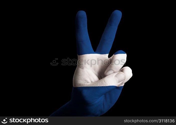 Hand with two finger up gesture in colored nicaragua national flag as symbol of winning, victorious, excellent, - for tourism and touristic advertising, positive political, cultural, social management of country