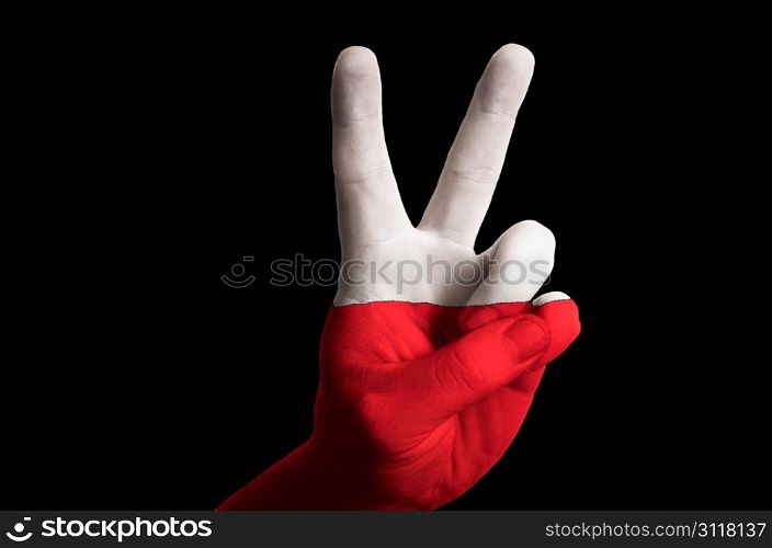Hand with two finger up gesture in colored poland national flag as symbol of winning, victorious, excellent, - for tourism and touristic advertising, positive political, cultural, social management of country