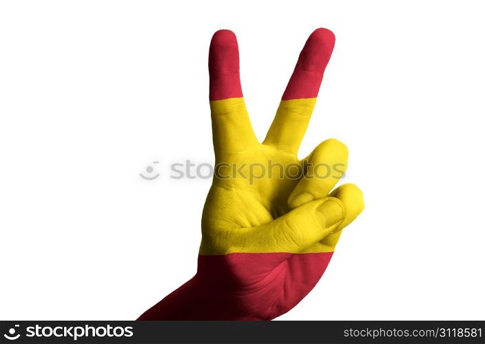 Hand with two finger up gesture in colored spain national flag as symbol of winning, victorious, excellent, - for tourism and touristic advertising, positive political, cultural, social management of country