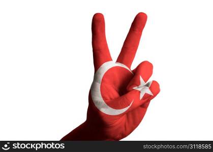 Hand with two finger up gesture in colored turkey national flag as symbol of winning, victorious, excellent, - for tourism and touristic advertising, positive political, cultural, social management of country