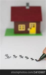 Hand write dollar symbols and house on background. Real estate conception