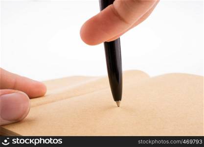 Hand writing on a notebook with a pen