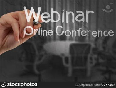 hand writing Webinar with crumpled paper background as concept