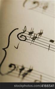 hand-written musical notation background.