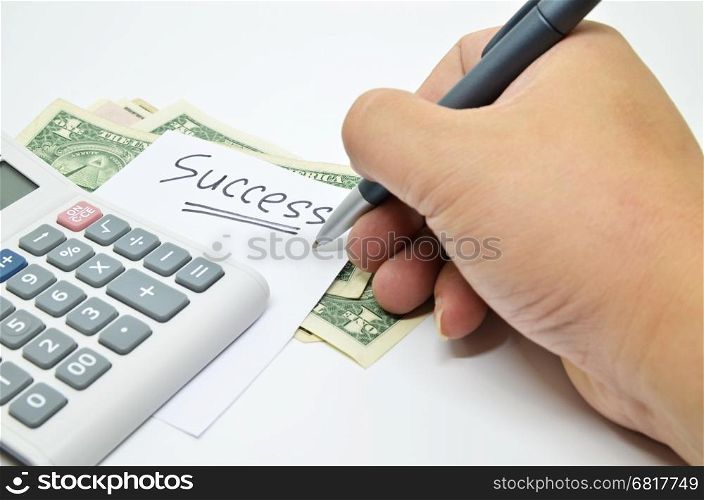 Hand written success word on paper. Business success concept