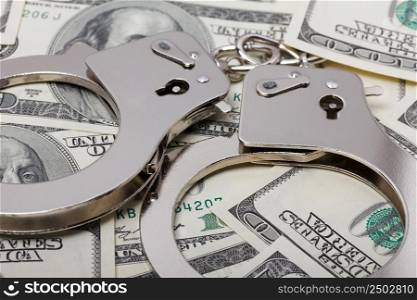 Handcuffs on money close up