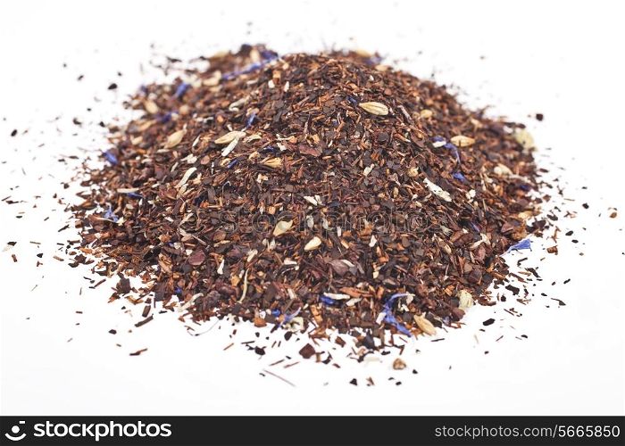 handful of herbal tea isolated on white background close up