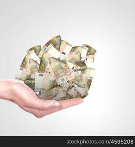 Handful Of Money. Human hand holding money on white background