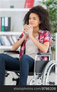 handicapped woman drinking beverage