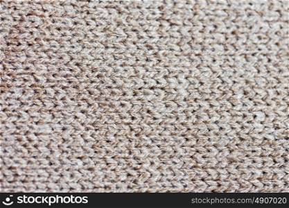 handicraft, knitwear and needlework concept - close up of knitted item. close up of knitted item