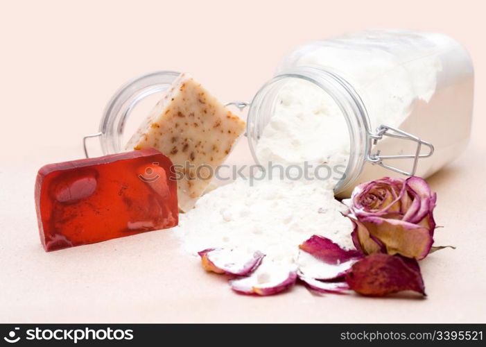 handicraft soap and jar of goat milk with natural components for bathing, shallow DOF