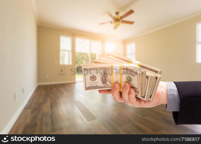 Handing Over Thousands of Dollars In Empty Room of House.