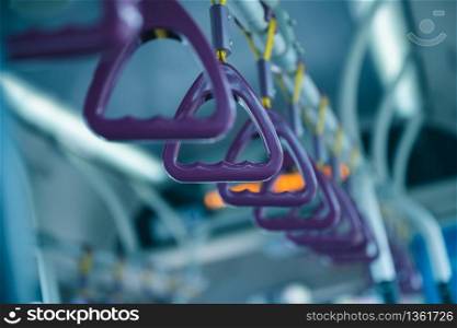 Handle on ceiling of bus, a train, MRT, prevent toppling.underground railway system,vintage color ,copy space
