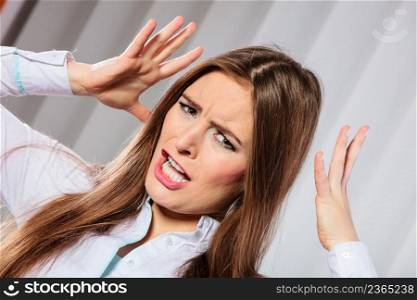Handling stress and emotions in work. Frustrated female scream feel anger and pain. Hands in air and open mouth. Formal dressed woman with headache.. Angry young woman shout.